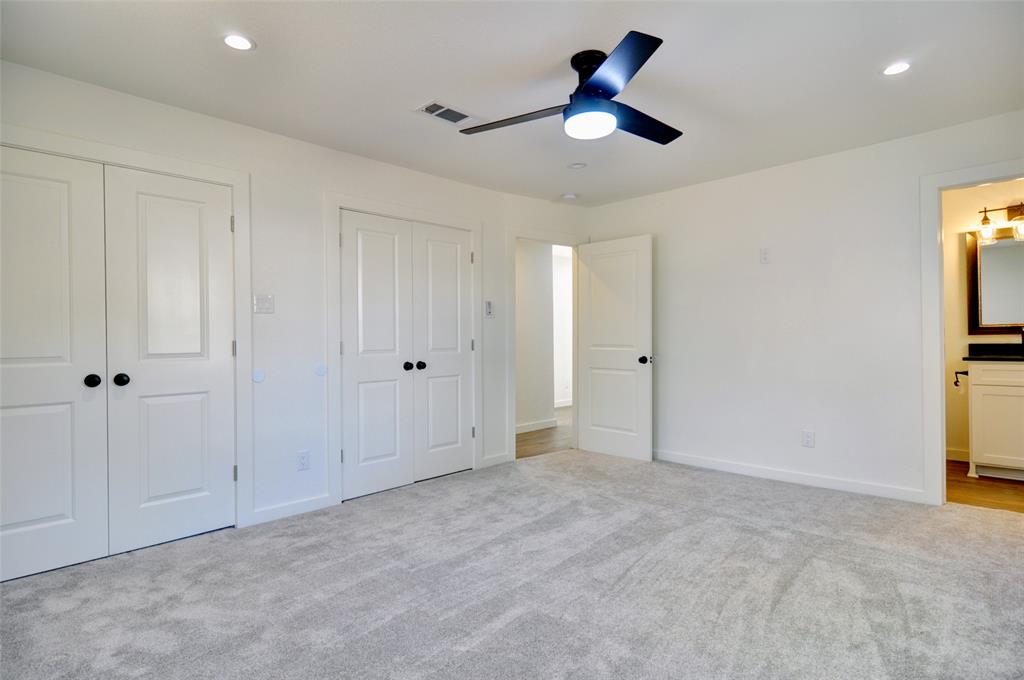 5549 Sam Calloway Road Fort Worth, TX 76114 - Photo 18 of 31 an empty room with closet and a chandelier fan
