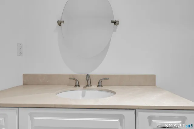 a bathroom with a sink and vanity