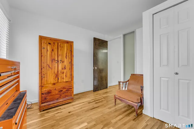 a view of an empty room and wooden floor