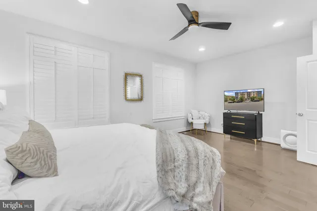 a bedroom with a bed and a television