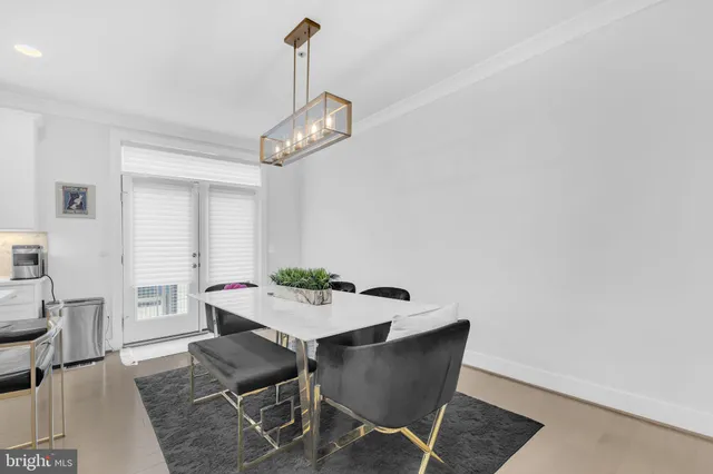 a kitchen with stainless steel appliances kitchen island a refrigerator and a stove top oven