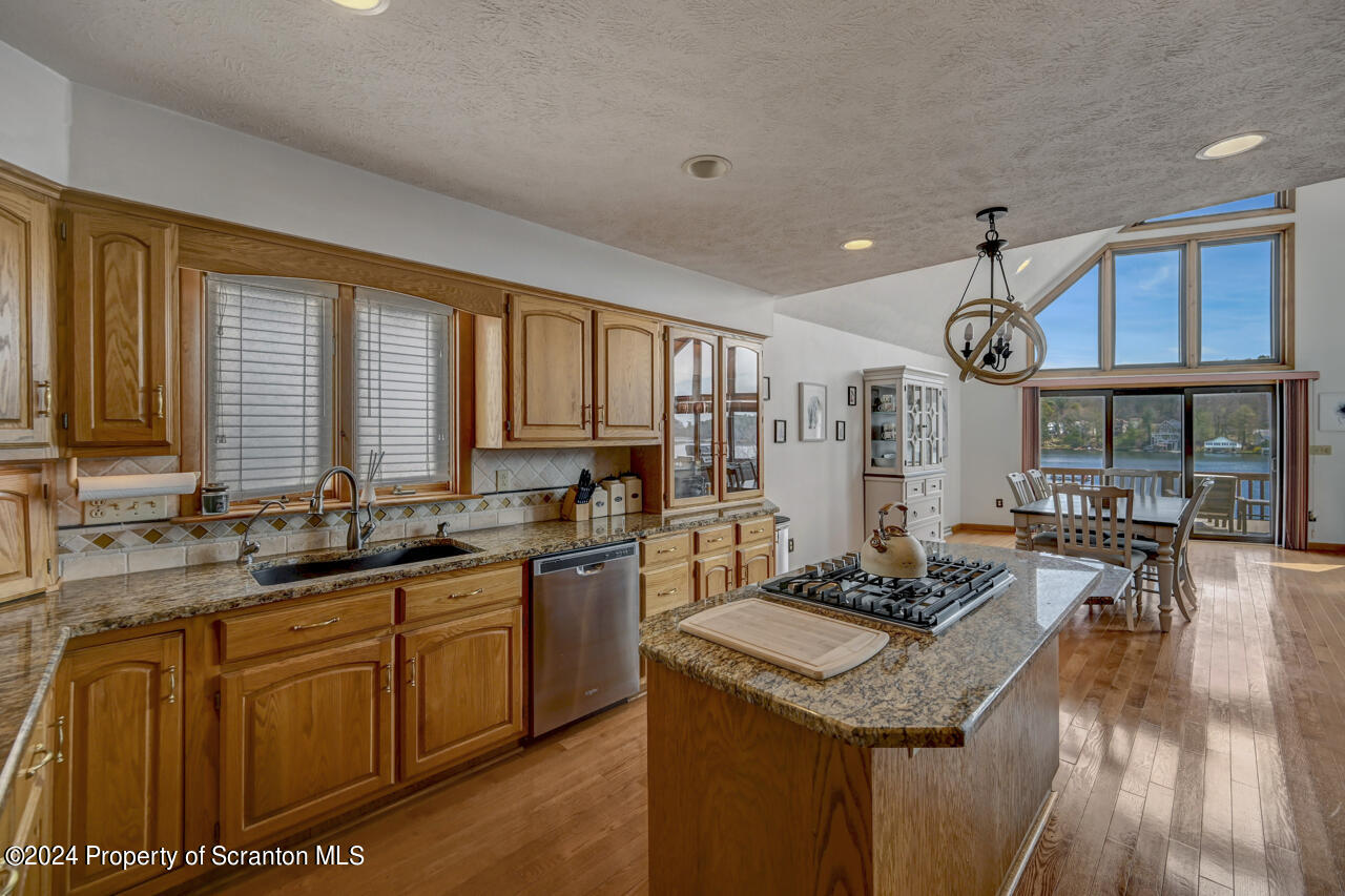 428 Point Road Lake Winola, PA 18419 - Photo 15 of 74 a kitchen with lots of counter top space and wooden floor