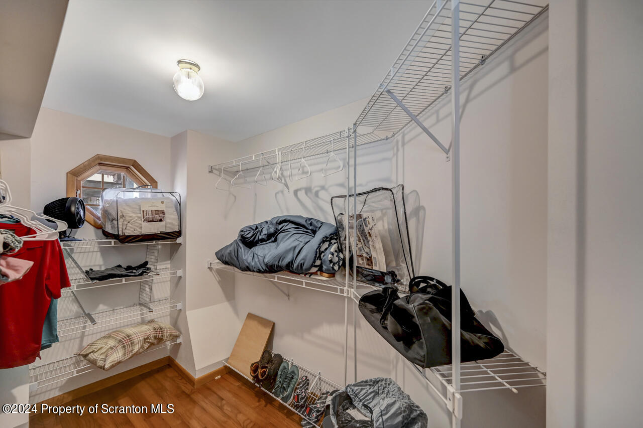 428 Point Road Lake Winola, PA 18419 - Photo 25 of 74 a view of walk in closet with clothes and shoes