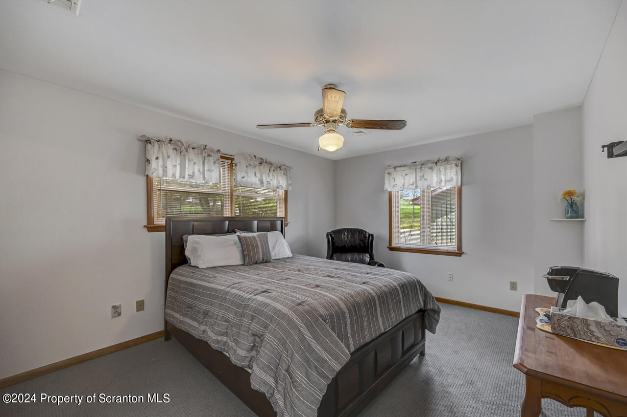 428 Point Road Lake Winola, PA 18419 - Photo 35 of 74 a bedroom with a bed and a window