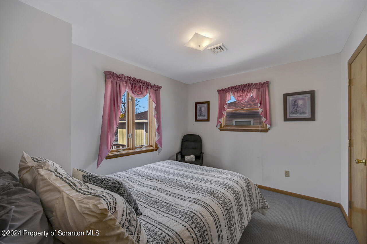 428 Point Road Lake Winola, PA 18419 - Photo 36 of 74 a bedroom with bed and a window