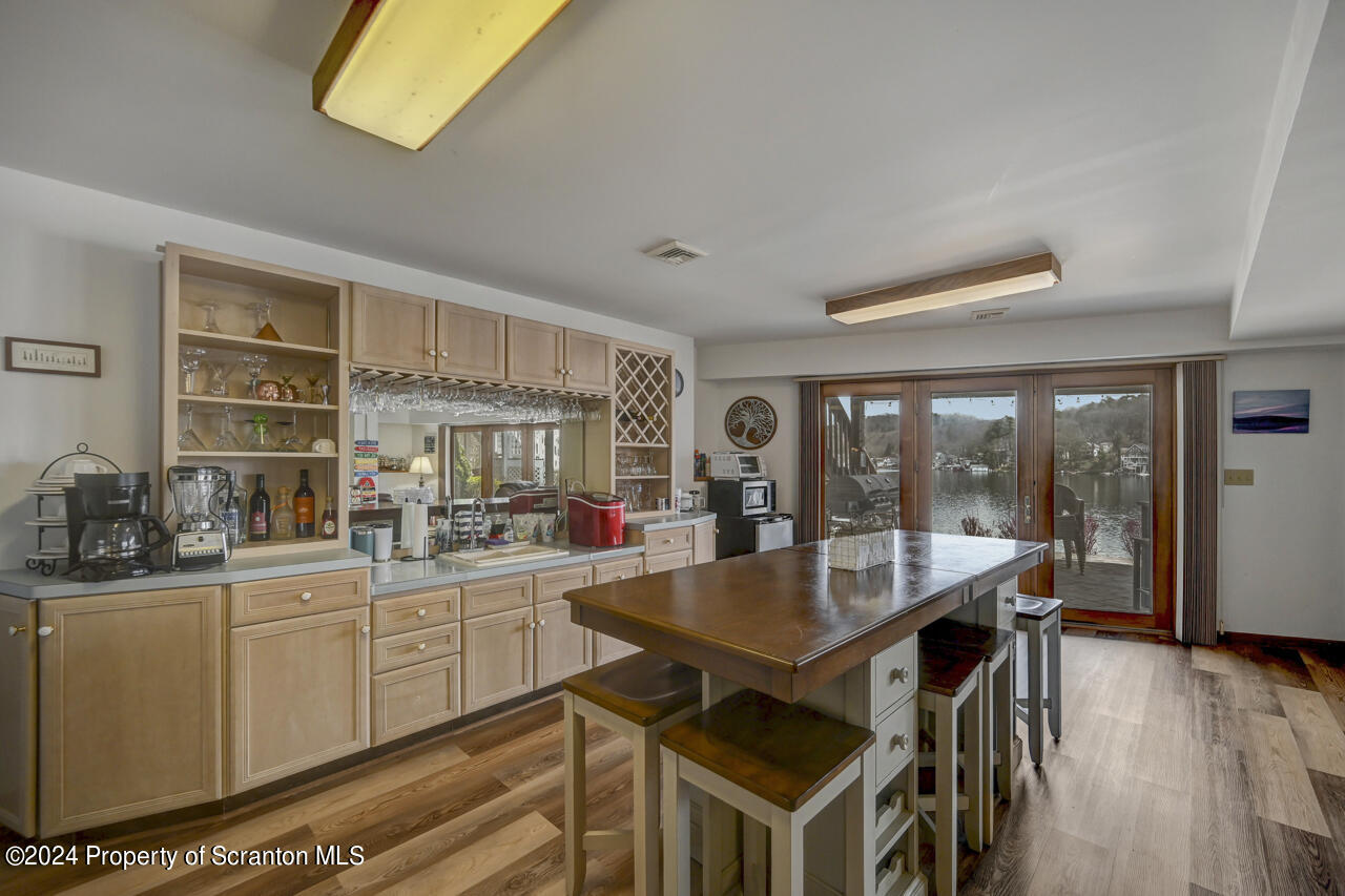 428 Point Road Lake Winola, PA 18419 - Photo 41 of 74 a kitchen with a table chairs stove and cabinets