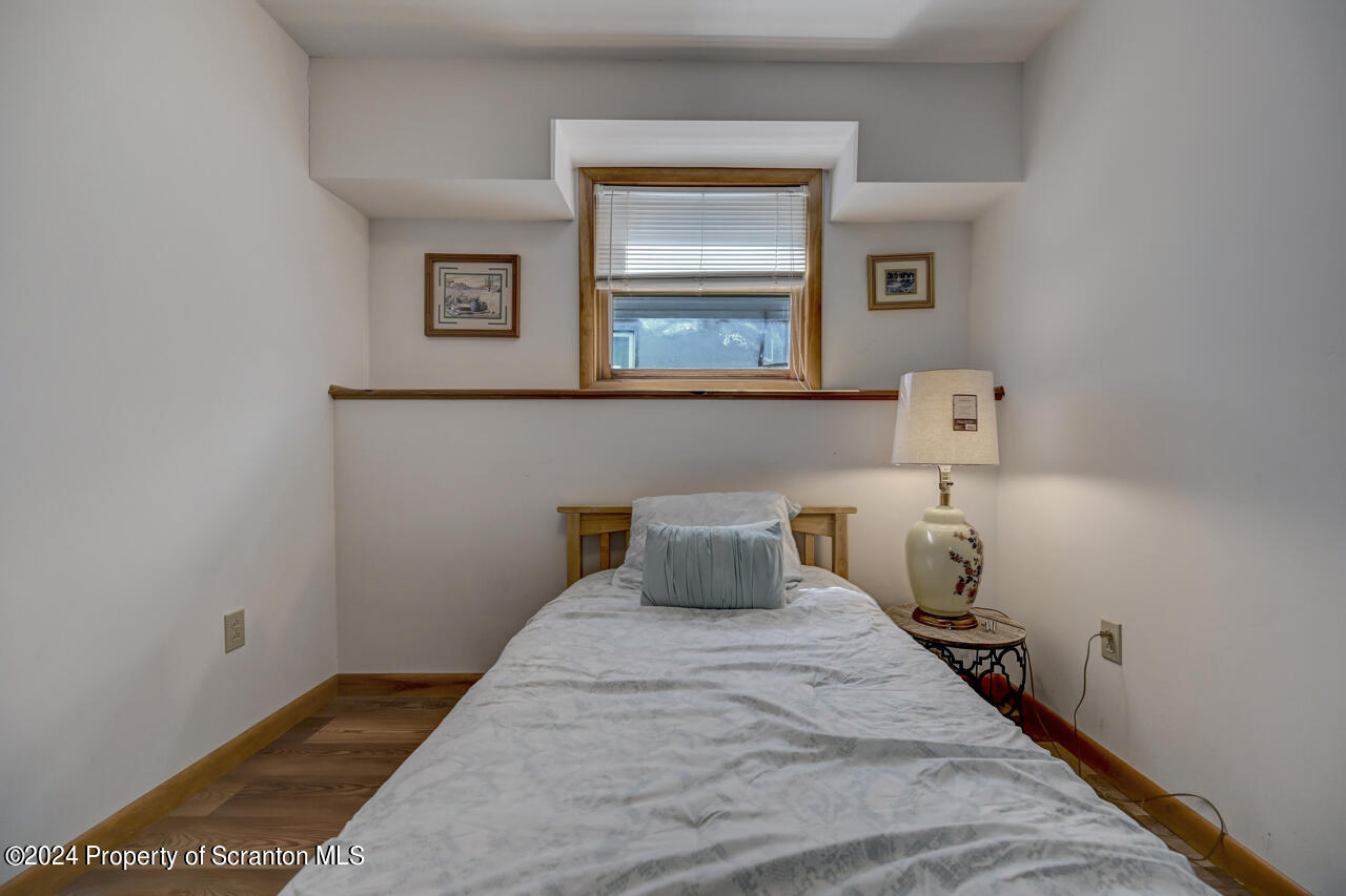 428 Point Road Lake Winola, PA 18419 - Photo 44 of 74 a bedroom with a bed and window