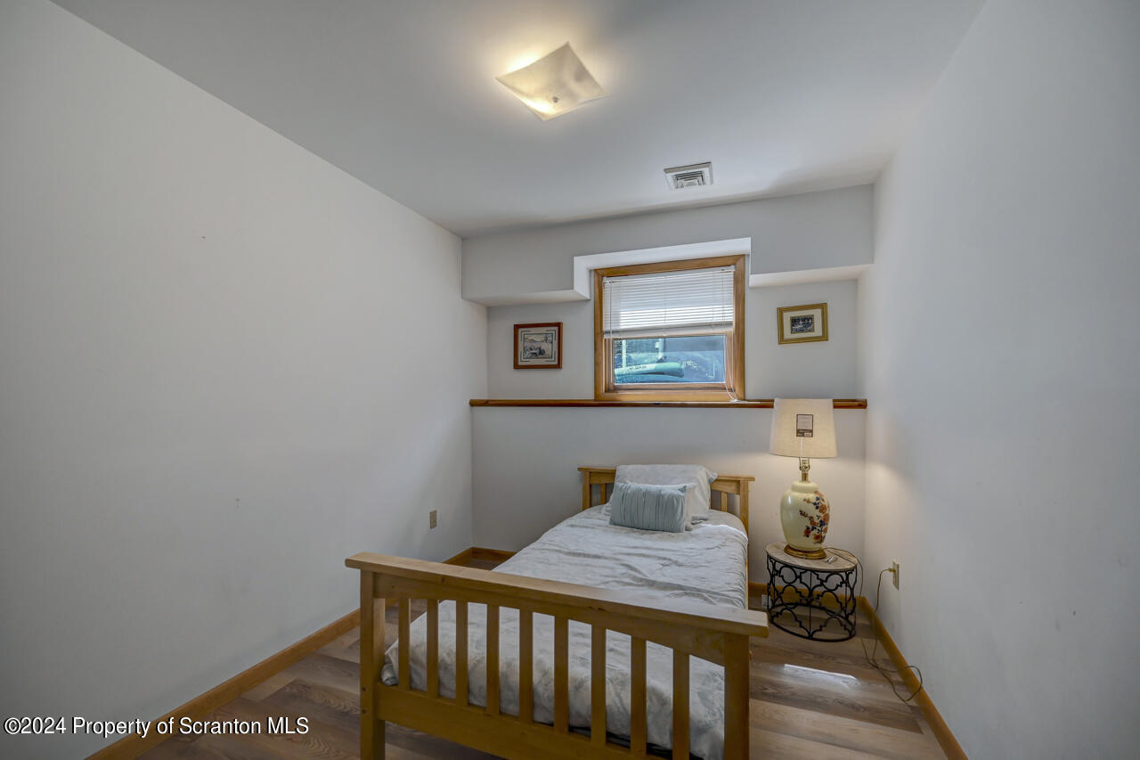 428 Point Road Lake Winola, PA 18419 - Photo 46 of 74 a bedroom with a bed and a window