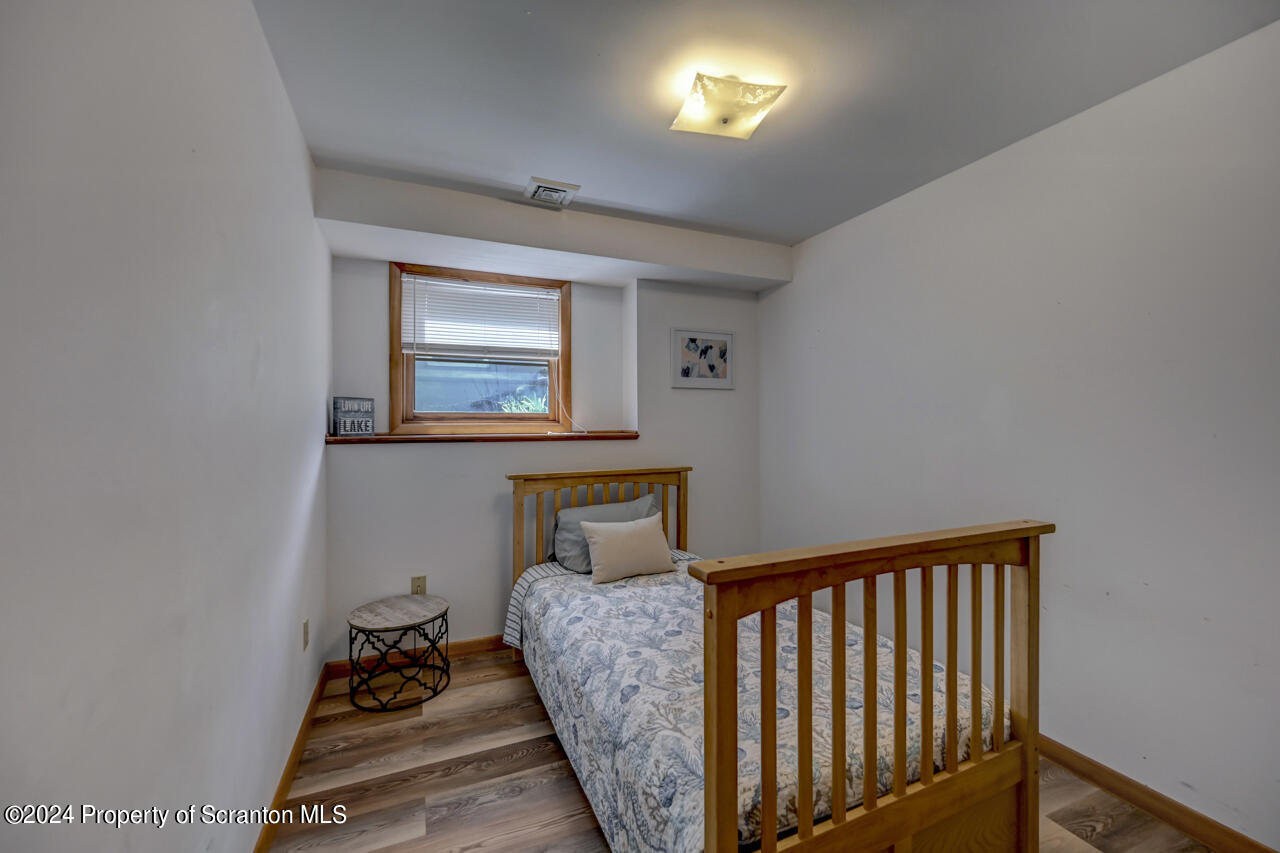 428 Point Road Lake Winola, PA 18419 - Photo 48 of 74 a bedroom with bed and a window