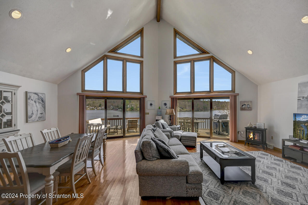 428 Point Road Lake Winola, PA 18419 - Photo 5 of 74 a living room with furniture and a floor to ceiling window