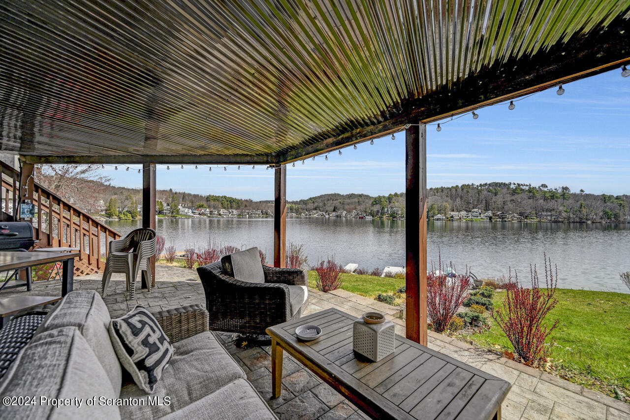 428 Point Road Lake Winola, PA 18419 - Photo 53 of 74 a view of a balcony with lake view and a couches