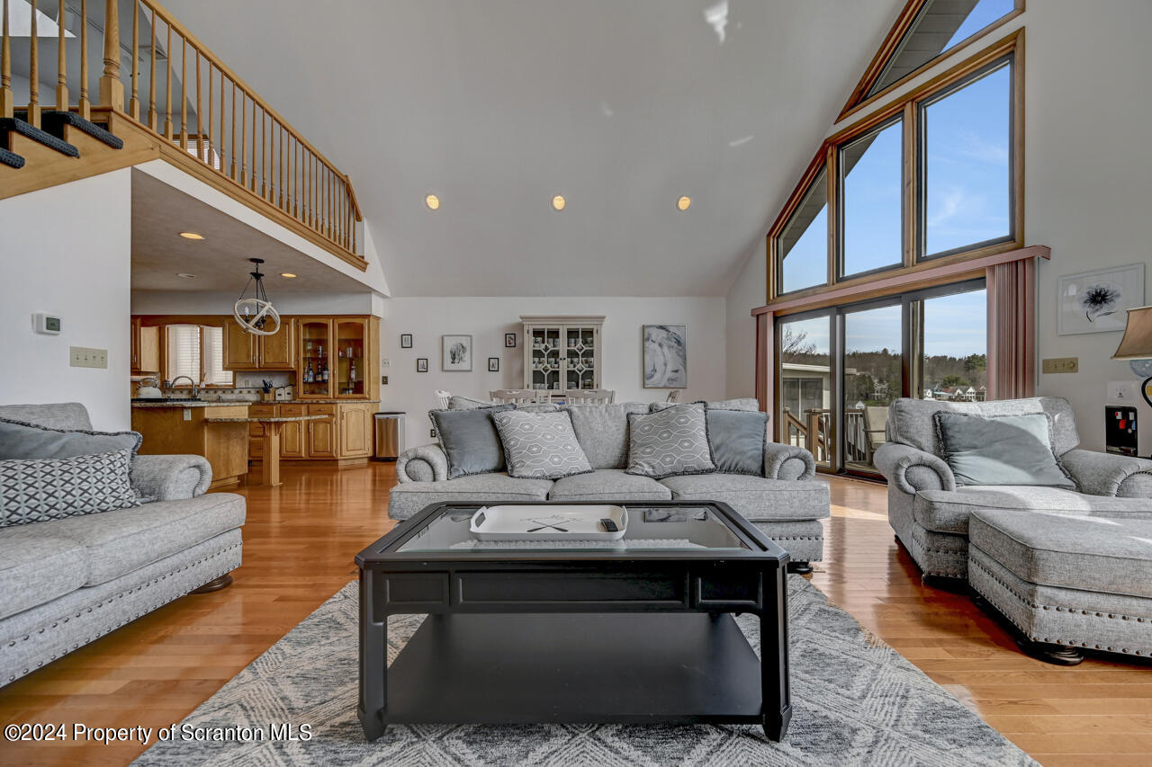 428 Point Road Lake Winola, PA 18419 - Photo 8 of 74 a living room with furniture wooden floor and a large window