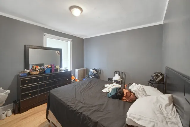 a bed room with a bed and a television