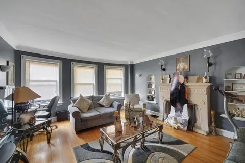 a living room with furniture or couch and a flat screen tv