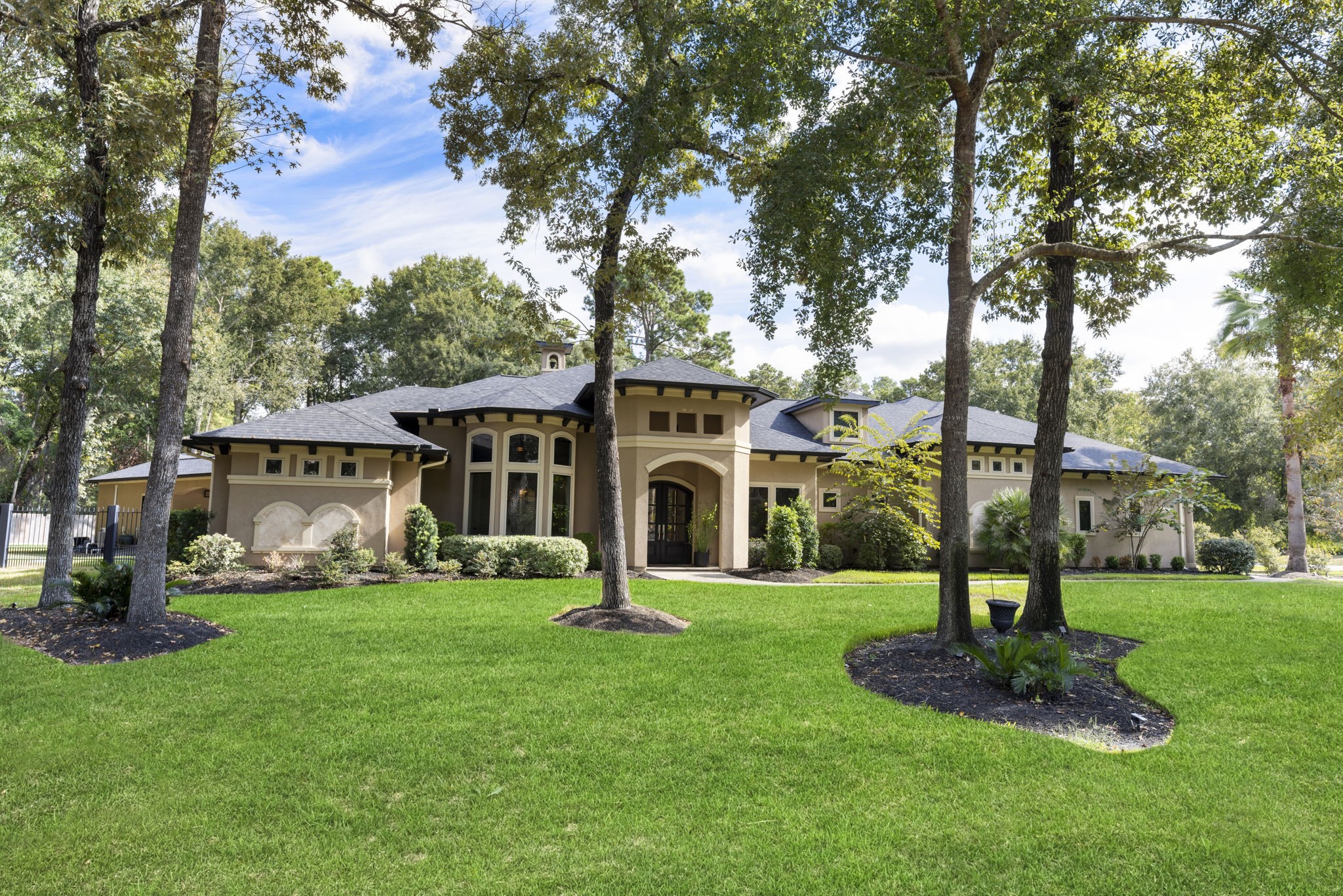 4103 Tee Tree Court Spring, TX 77386 - Photo 1 of 37 Beautiful curb appeal on a private 1.06-acre cul-de-sac lot surrounded by mature trees. Custom 1.5-story design with a NEW ROOF installed October 2025.