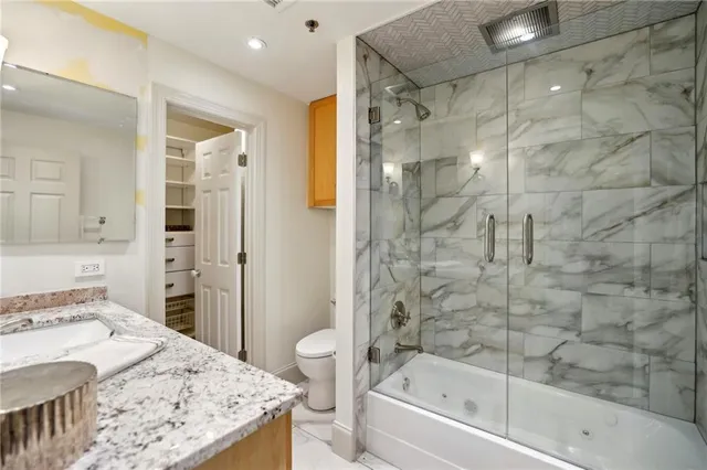 a bathroom with a bathtub and a sink