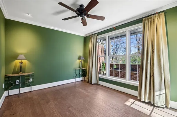 a view of a livingroom with a ceiling fan and a window