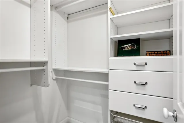 a view of an empty walk in closet