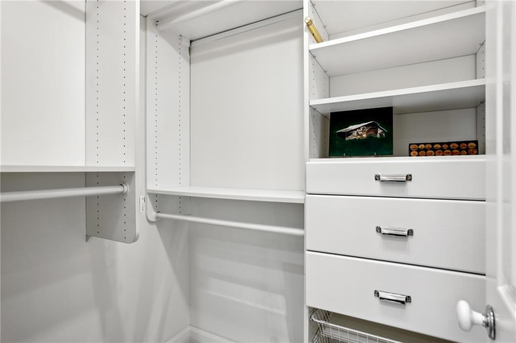 3101 Howell Mill Road Northwest, Unit 121 Atlanta, GA 30327 - Photo 18 of 38 a view of an empty walk in closet