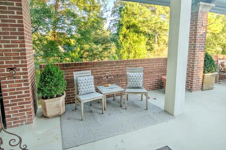 3101 Howell Mill Road Northwest, Unit 121 Atlanta, GA 30327 - Photo 22 of 40 a view of a chairs and table in the balcony