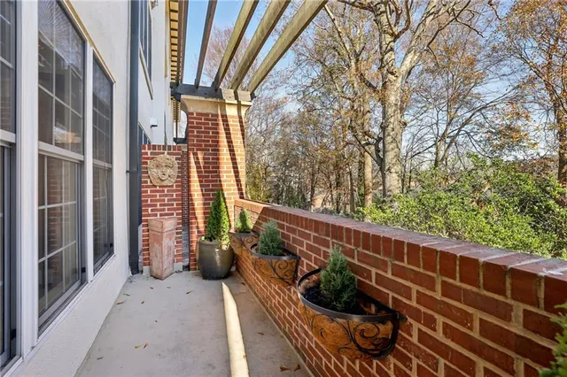 a view of balcony with furniture