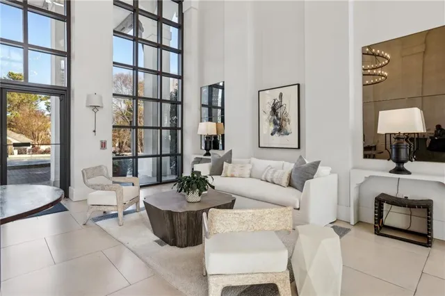 a living room with furniture and a potted plant