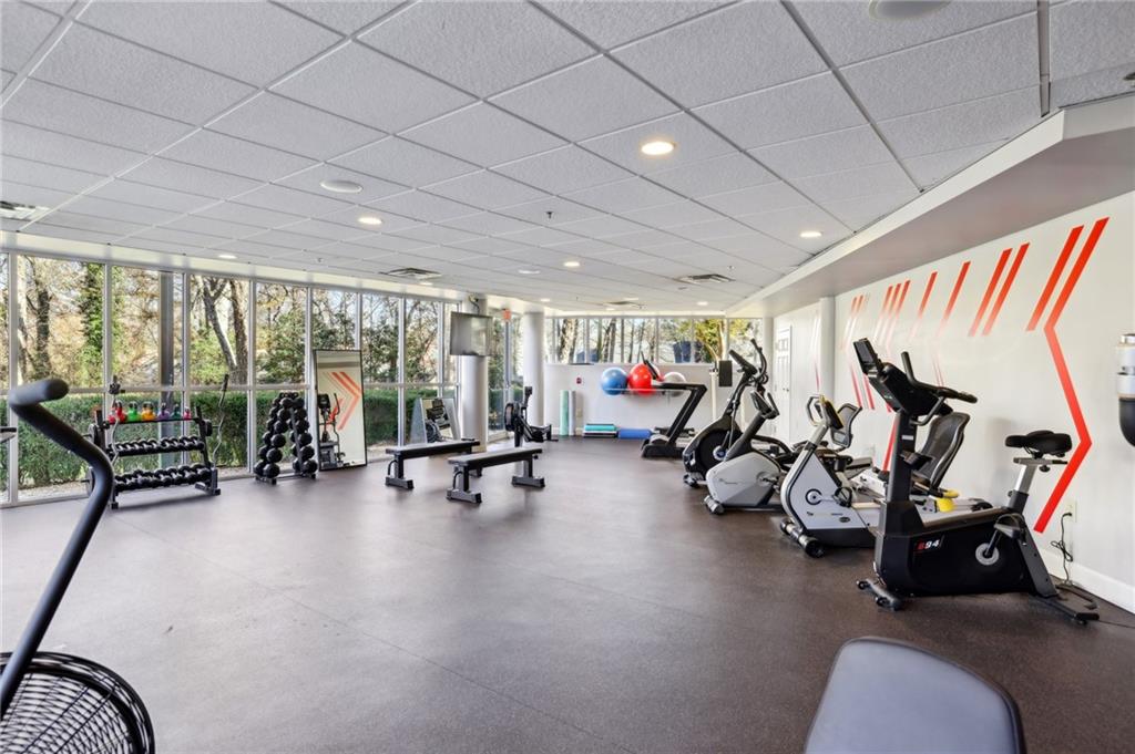 3101 Howell Mill Road Northwest, Unit 121 Atlanta, GA 30327 - Photo 35 of 38 a view of a room with gym equipment