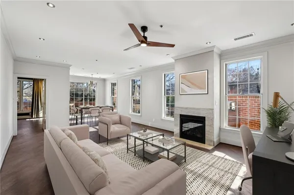 a living room with furniture and a fireplace