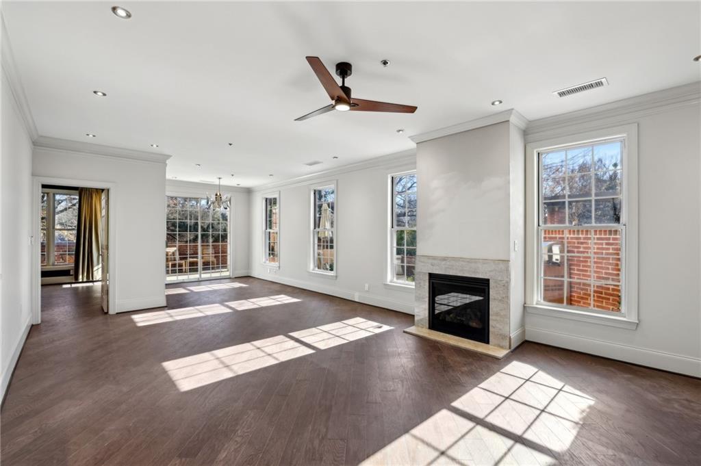 3101 Howell Mill Road Northwest, Unit 121 Atlanta, GA 30327 - Photo 6 of 40 a view of an empty room with window and fire place