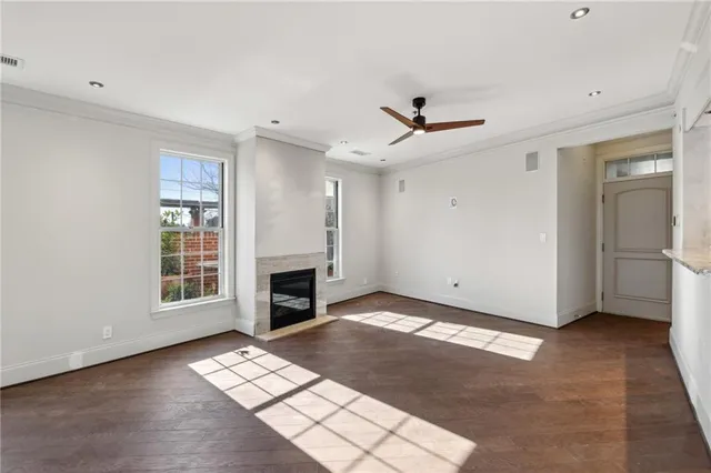 a view of livingroom with window ceiling fan and hardwood floor