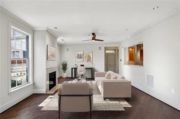 a living room with furniture and a fireplace
