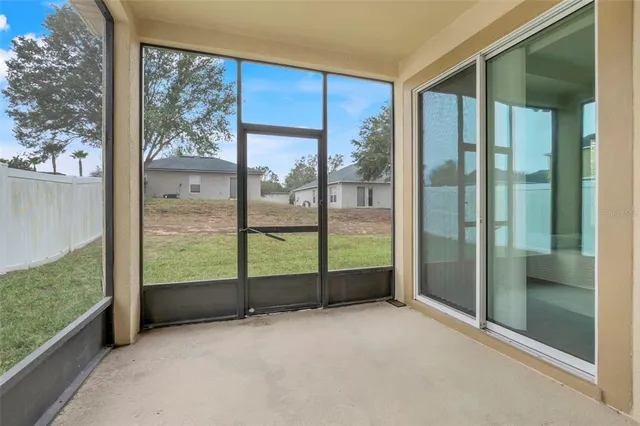 a view of a room with sliding glass door and mountain view