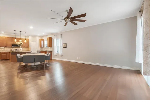 a dining room with furniture and window