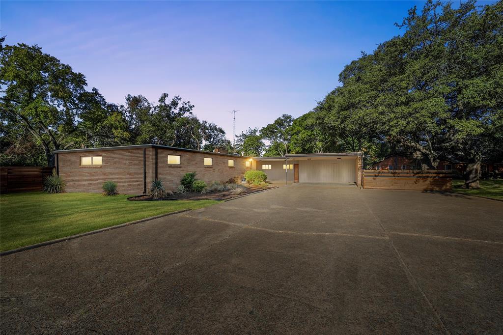 3600 MacArthur Drive Waco, TX 76708 - Photo 1 of 1 View of front facade with driveway, brick siding, and an attached carport