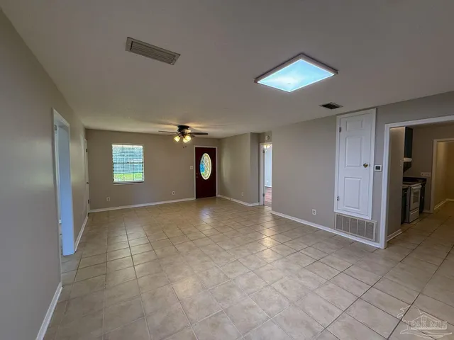 a view of an empty room and window