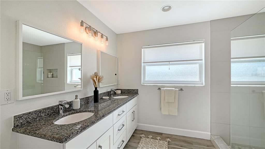 2115 Grove Street Sarasota, FL 34239 - Photo 21 of 40 a bathroom with a granite countertop sink mirror and