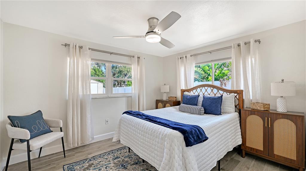 2115 Grove Street Sarasota, FL 34239 - Photo 23 of 40 a bedroom with a bed and wooden floor