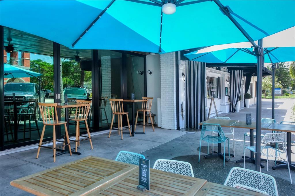 2115 Grove Street Sarasota, FL 34239 - Photo 38 of 40 a view of a patio with a table chairs and backyard