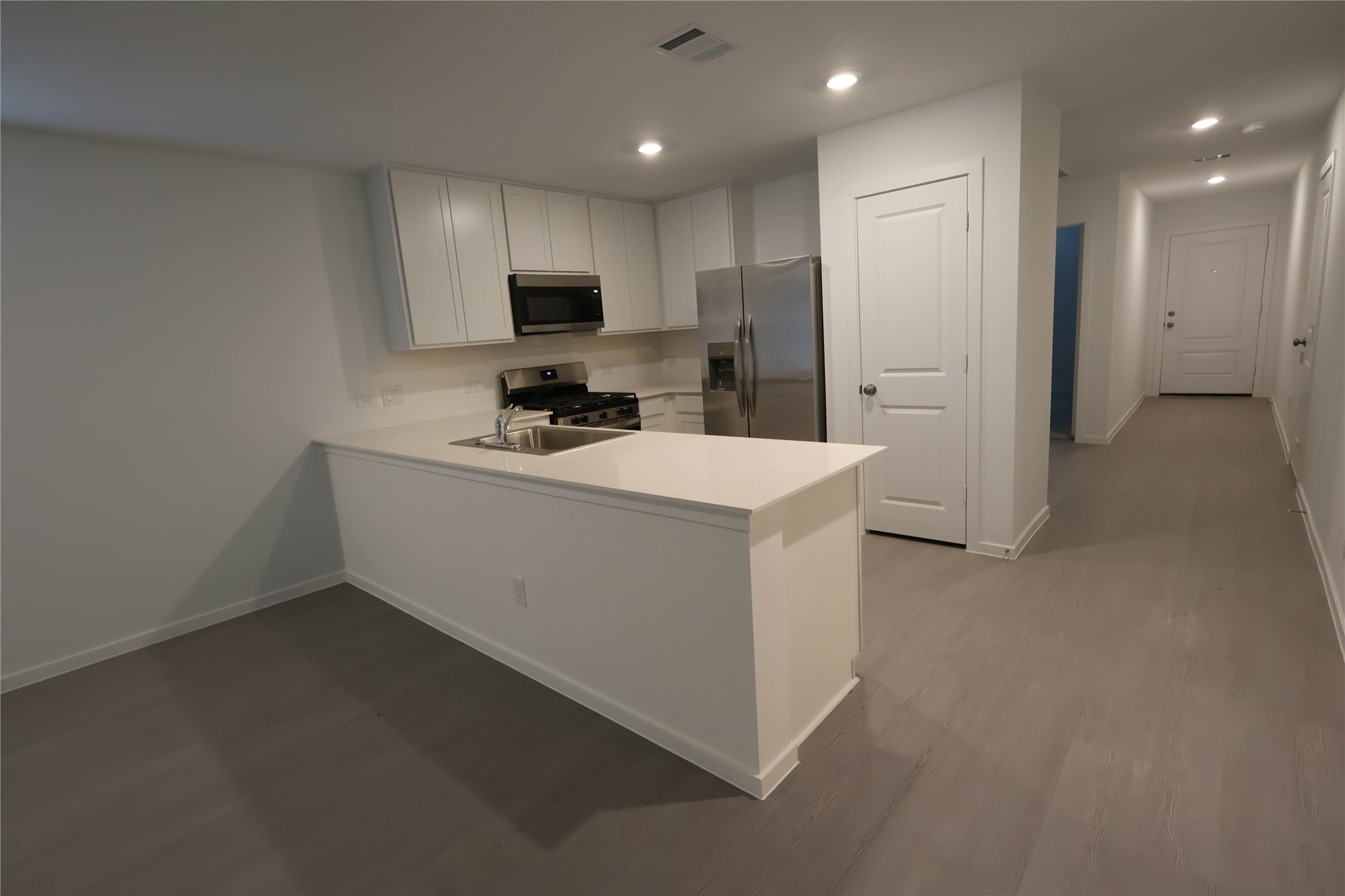 3020 Colusa Rdg Drive Katy, TX 77493 - Photo 5 of 16 a kitchen with a sink a refrigerator and cabinets