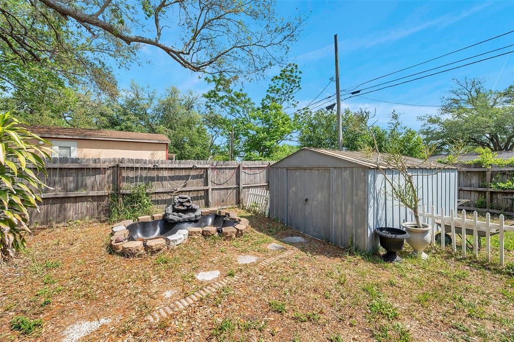 8844 Mike Street Port Richey, FL 34668 - Photo 11 of 51 a view of backyard with small cabin