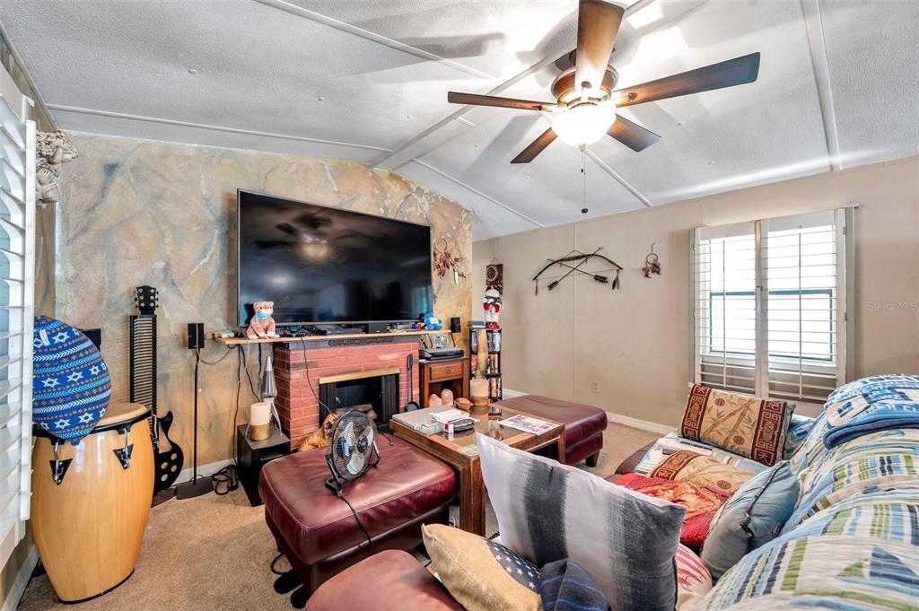 8844 Mike Street Port Richey, FL 34668 - Photo 23 of 51 a living room with furniture and a flat screen tv