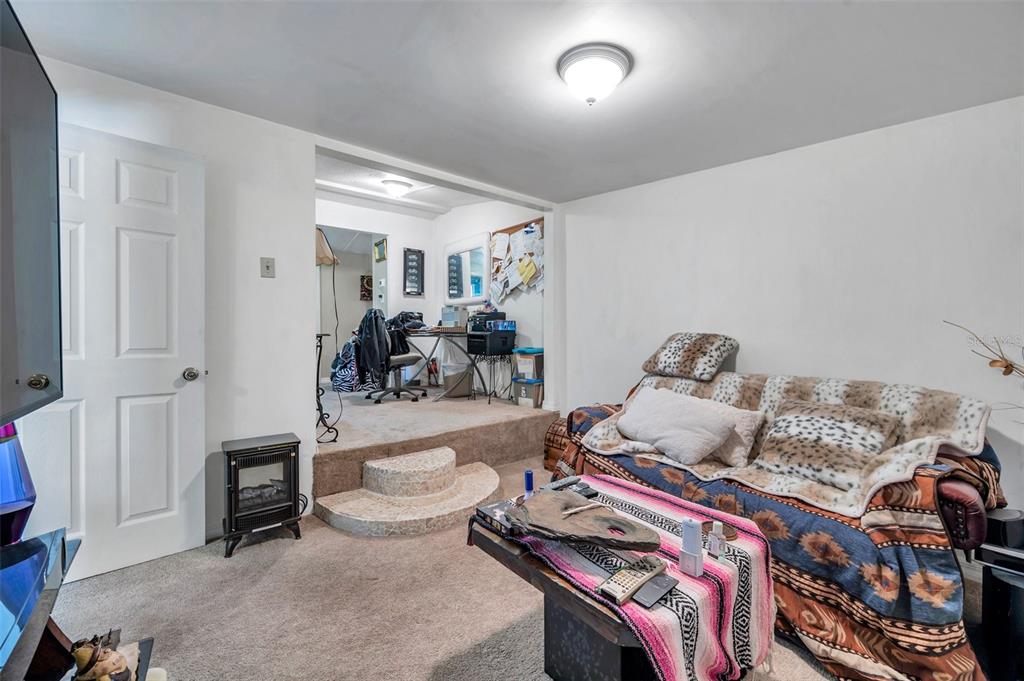 8844 Mike Street Port Richey, FL 34668 - Photo 32 of 51 a living room with furniture and a wooden floor