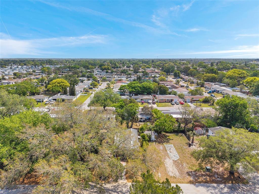8844 Mike Street Port Richey, FL 34668 - Photo 36 of 51 an aerial view of residential building and lake