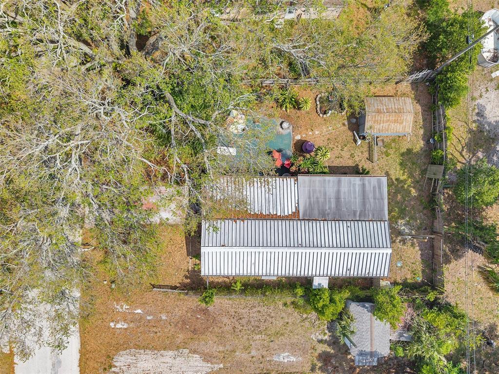 8844 Mike Street Port Richey, FL 34668 - Photo 43 of 51 a view of a brick wall with a tree in front of it