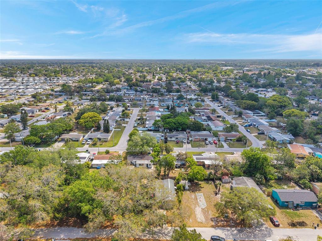 8844 Mike Street Port Richey, FL 34668 - Photo 44 of 51 an aerial view of residential building and lake