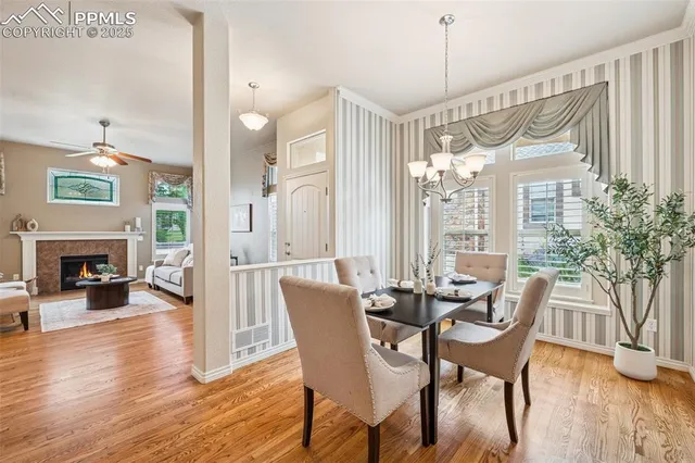 a view of a dining room with furniture window and wooden floor