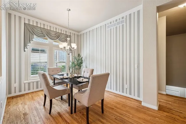a dining room with furniture window wooden floor