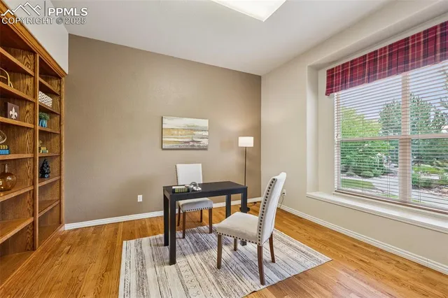 a view of a livingroom with lounge chair and a window