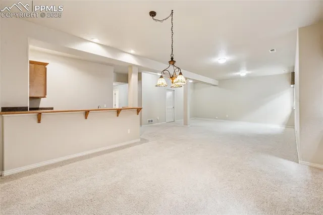 a view of a kitchen with a sink and a window
