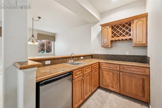 a utility room with a sink and a window